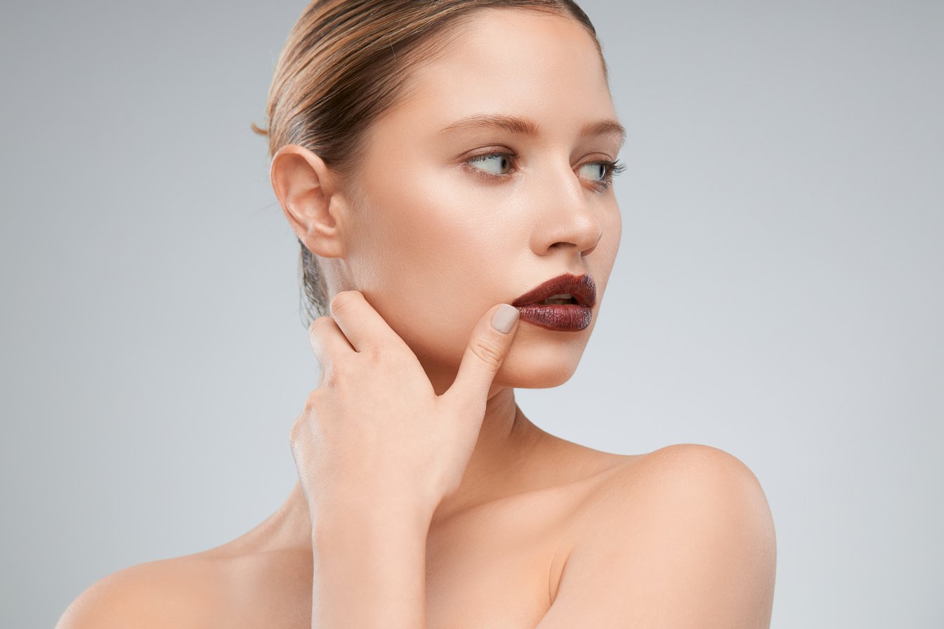 Beautiful lady posing with brown lipstick. Beauty photography